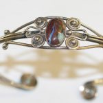 An Arts & Crafts boulder opal torque bangle