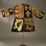 Red and blue silk velvet tabard, applied with cloth of gold and linen, embroidered with silver and silver-gilt thread, twist, bullion and purl in laid and couched work.