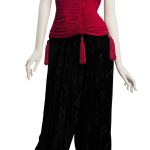 A RED RUCHED SILK BUSTIER & BLACK CRUSHED VELVET HAREM PANTS