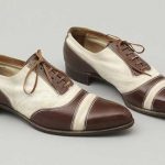 Pair of men's shoes of polished tan brown leather and white suede